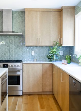 wood kitchen with blue tiles