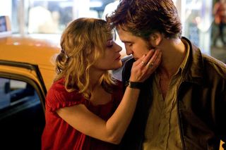 Emilie de Ravin and Robert Pattinson share a kiss in 'Remember Me'