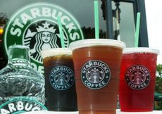WASHINGTON - JULY 2: Starbucks' new iced coffee and tea beverages are displayed during a promotion July 2, 2003 outside a Starbucks coffee shop at Dupont Circle in Washington, DC. Starbucks introduced a new line of iced tea, coffee and tea lemonade drinks to their customers to cool down in the summer. (Photo by Alex Wong/Getty Images)