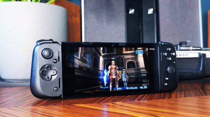 Razer Edge handheld on woodgrain table with Final Fantasy 12 gameplay on screen.