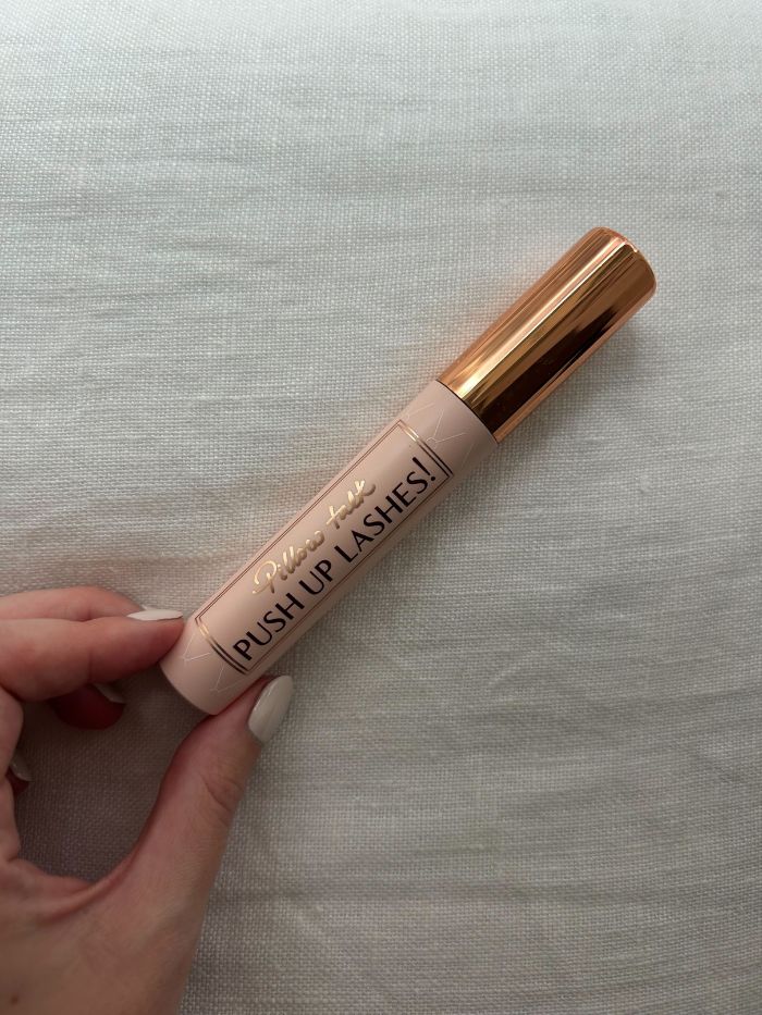 The Charlotte Tilbury Pillow Talk Push Up Lashes Mascara on a white linen background