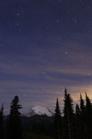 "I had planned on photographing Washington’s Mt. Rainier under clear starry skies, lit by a crescent moon, but a low cloud mass began to move in, threatening to obliter ate the stars. But when I noticed the warm glow on the clouds from city lights over the mountains, I worked quickly to capture this image. The combination of stars, soft moonlight illuminating the mountain, and the warm glow added up to be an interesting picture, but soon after, the clouds covered the stars completely." (16–35mm lens at 31mm, f/2.8 for 15 sec, ISO 1600)