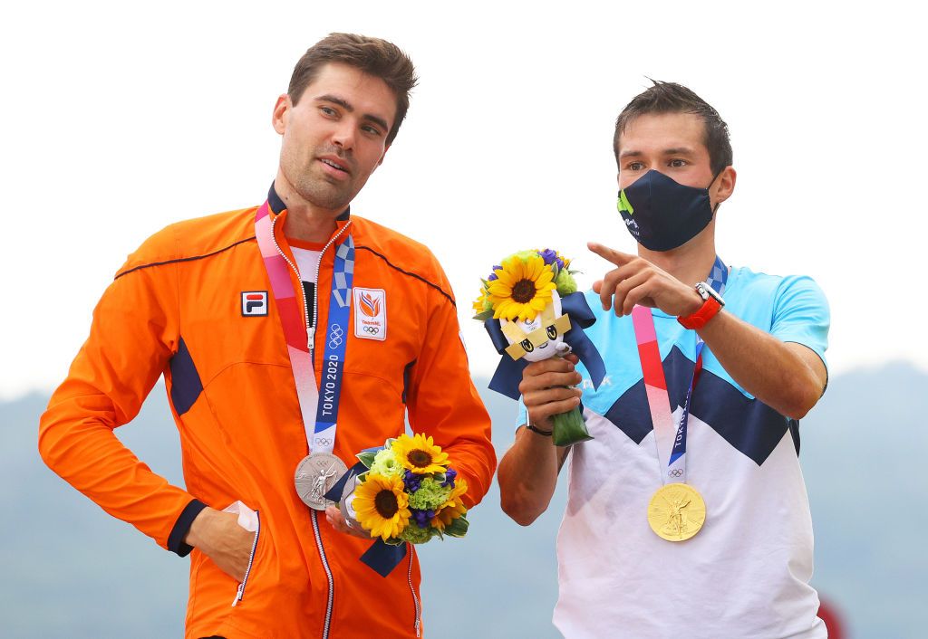 OYAMA JAPAN JULY 28 LR Silver medalist Tom Dumoulin of Team Netherlands and gold medalist Primoz Roglic of Team Slovenia speak on the podium during the medal ceremony after the Mens Individual time trial on day five of the Tokyo 2020 Olympic Games at Fuji International Speedway on July 28 2021 in Oyama Shizuoka Japan Photo by Tim de WaeleGetty Images