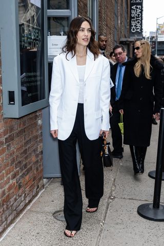 Alexa Chung styles a white single breasted blazer