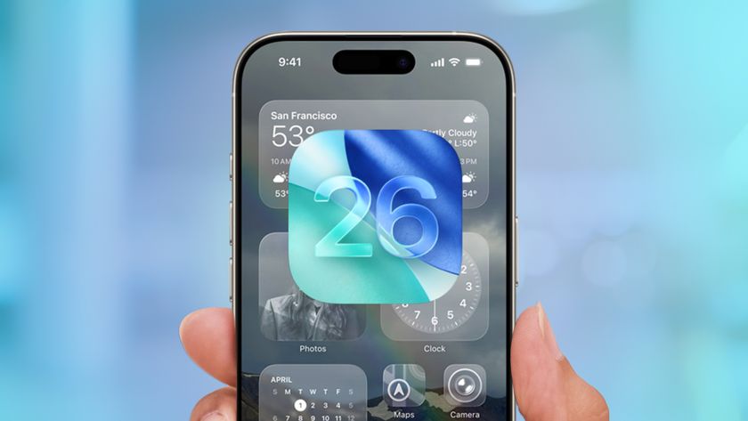 iOS 26 logo on top of the interface of an iPhone