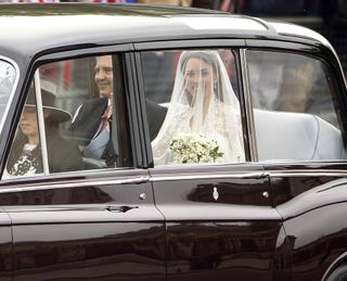 The car carrying Catherine Middleton and her father Michael Middleton is seen ahead of the Royal Wedding of Prince William to Catherine Middleton at Westminster Abbey on April 29, 2011 in London, England