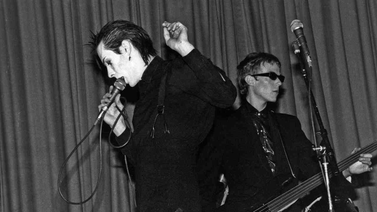 Bauhaus performing onstage in the early 1980s