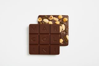 Pierre Marcolini Grand Cru square dark chocolate tablets with nuts and 'MARCOLINI' lettering