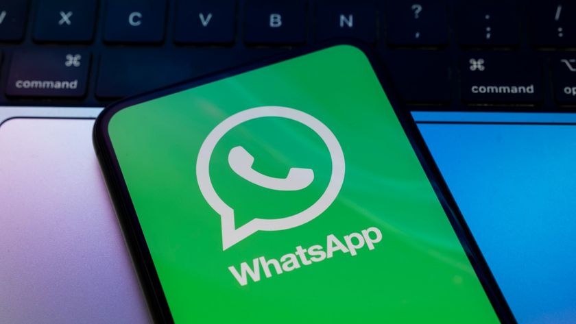 The WhatsApp logo is seen on a phone screen in a file photo.