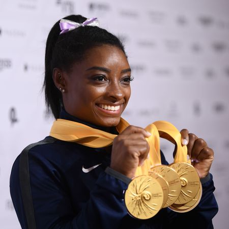stuttgart, germany october 13 simone biles of usa poses with her medal haul after the apparatus finals on day 10 of the fig artistic gymnastics world championships at hanns martin schleyer hall on october 13, 2019 in stuttgart, germany photo by laurence griffithsgetty images