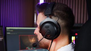 The Beyerdynamic MMX 330 Pro headset in black on a man's head