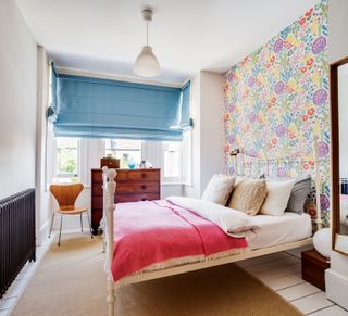 bedroom with feature wall and pink bedding photographed by Bruce Hemming