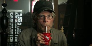 Stephen King, in a cameo from 'It Chapter Two,' drinks from a straw.