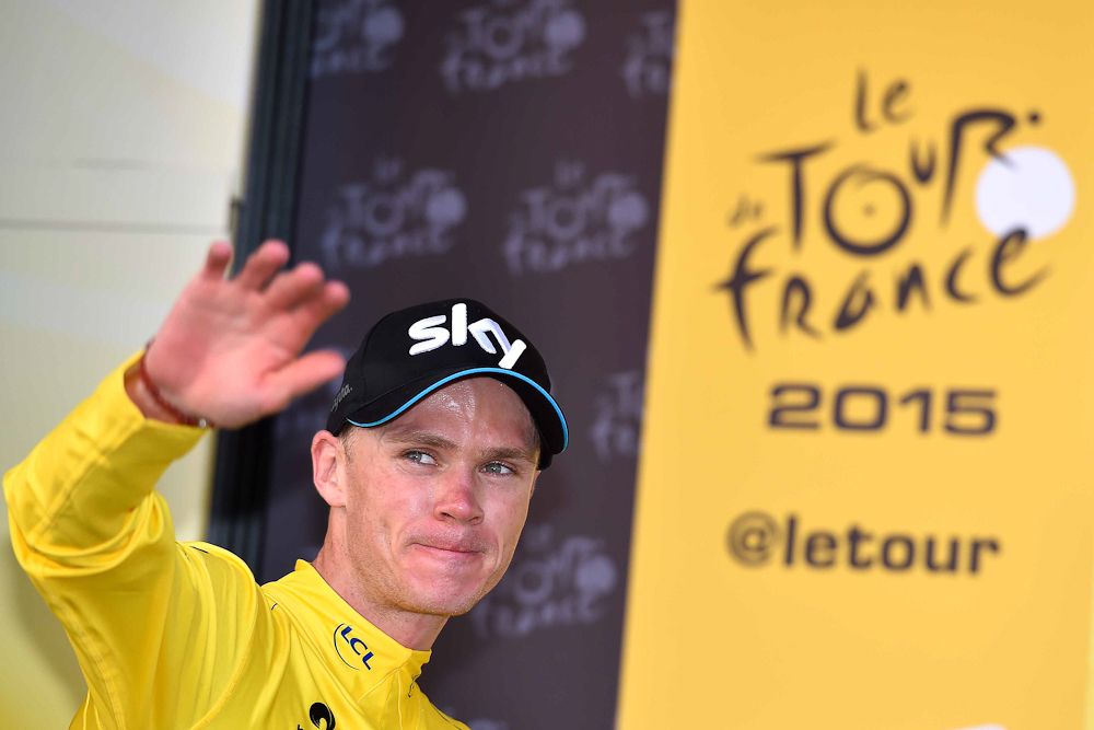 Chris Froome climbs onto the podium following stage 11.