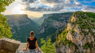 Woman overlooking Vikos Gorge, Greece