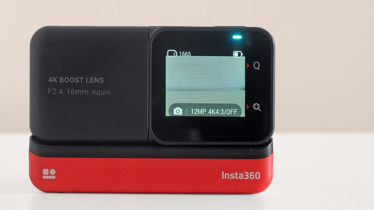 The Insta360 One RS action cam on a beige background