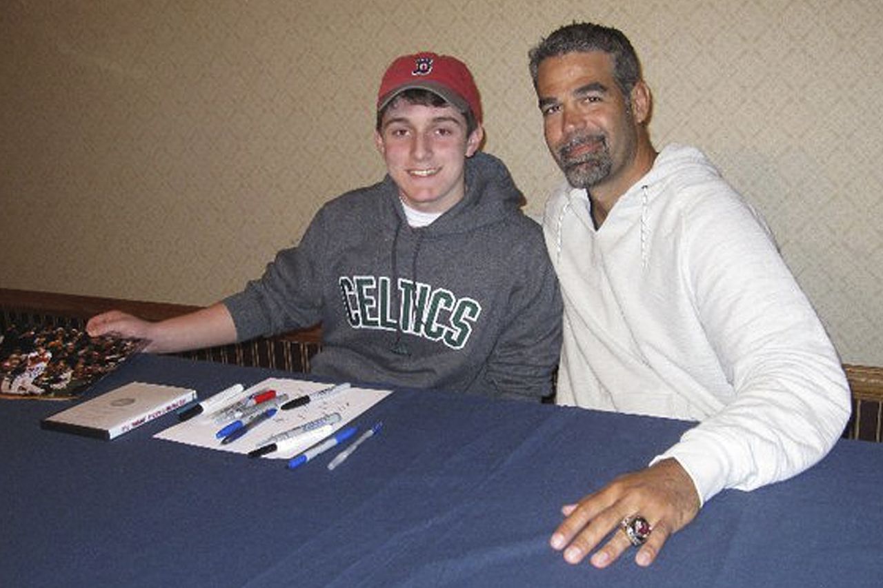 In this 2011 photo, Chris Cotillo poses with former Boston Red Sox third baseman Mike Lowell.