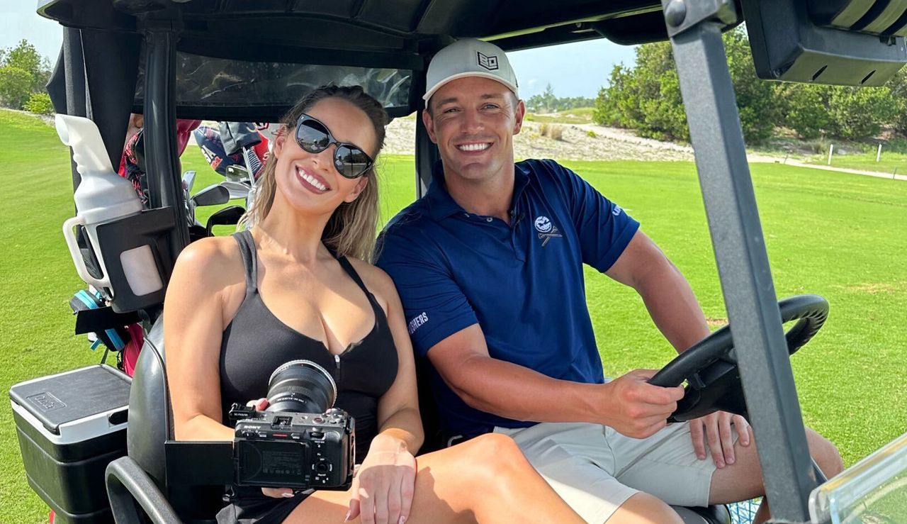 Paige Spiranac and Bryson DeChambeau pose for a photo