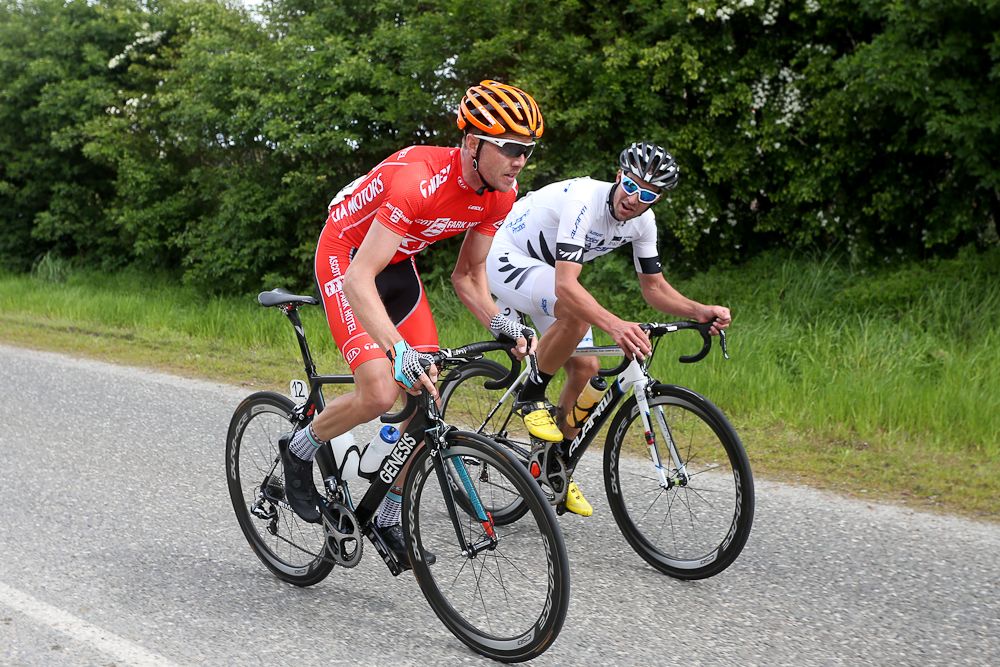 Mike Northey of North Shore (L) and Joseph Cooper of Wellington chat as they head towards Gore during stage five of the Tour of Southland