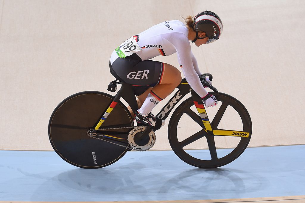 Kristina Vogel (Germany) sits on the top tube after her saddle broke off