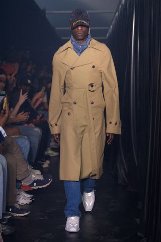 Man in trench coat at Martine Rose runway show
