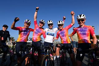 Lorena Wiebes (center) celebrates with her teammates after winning a stage of the UAE Tour women's race