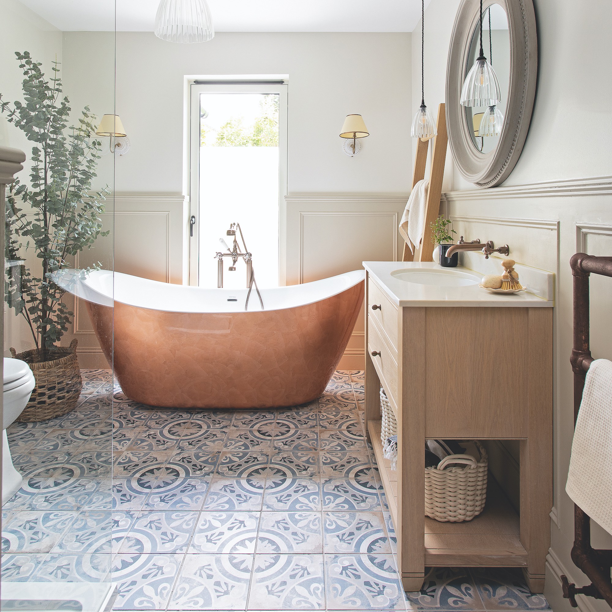 copper look bath with patterned floor tiles