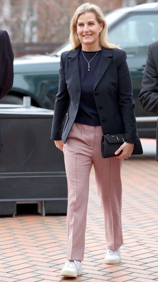 Sophie, Duchess of Edinburgh smiles as she arrives, wearing Puma trainers, at the All England Open Badminton Championships on March 14, 2024