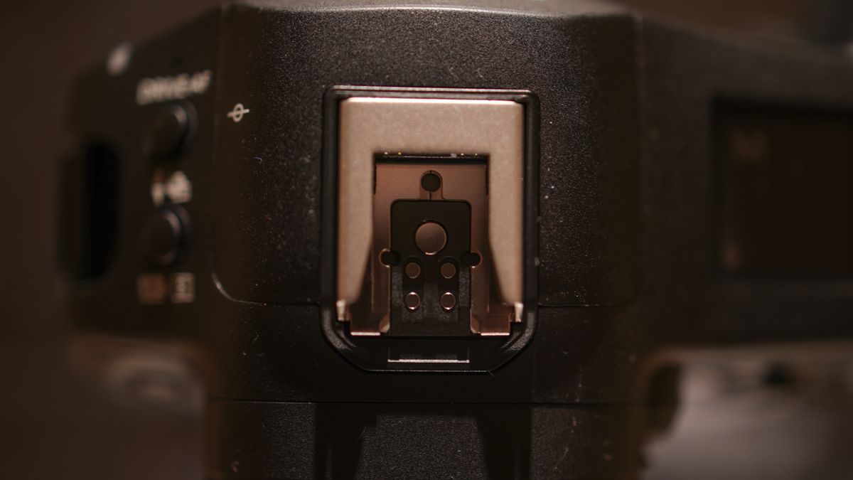 Canon EOS R1 against a dark background