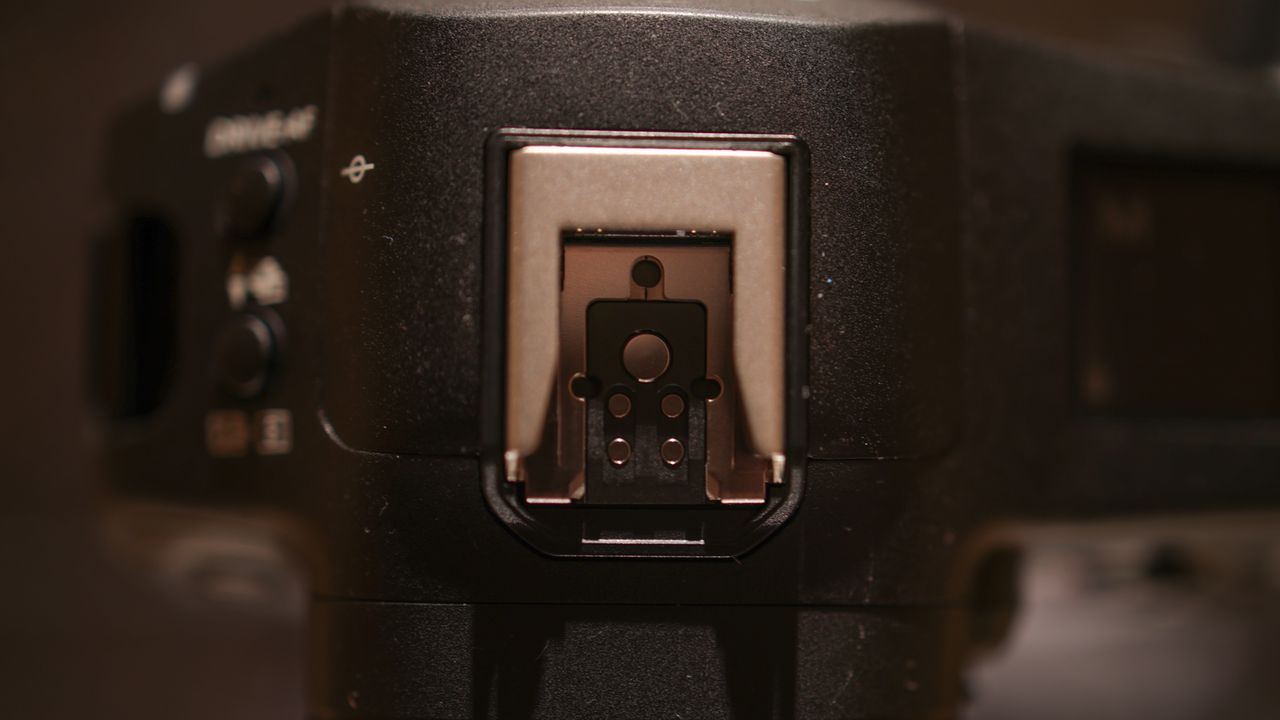Canon EOS R1 against a dark background