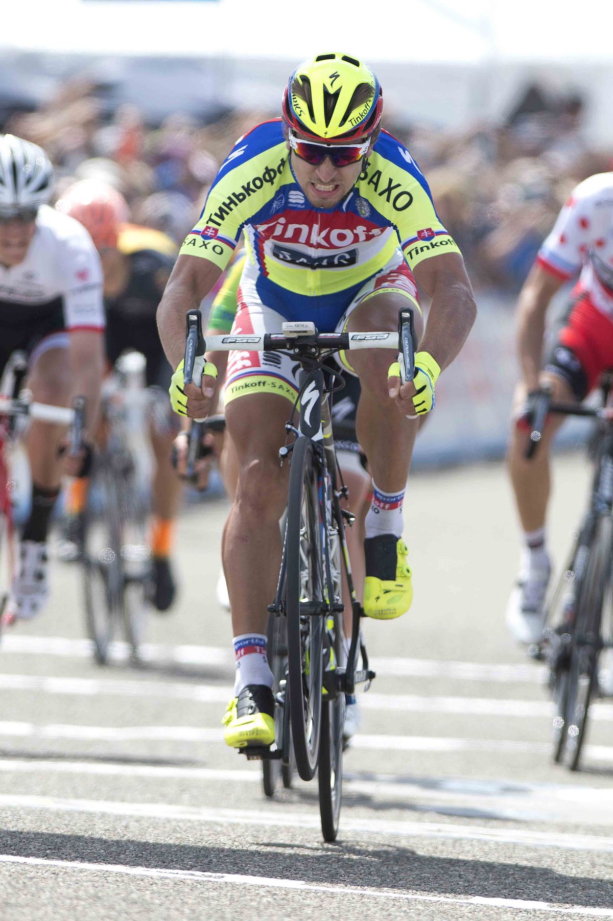 Peter Sagan (Tinkoff-Saxo) half wheelies/half slams his wheel up and down in relief of victory