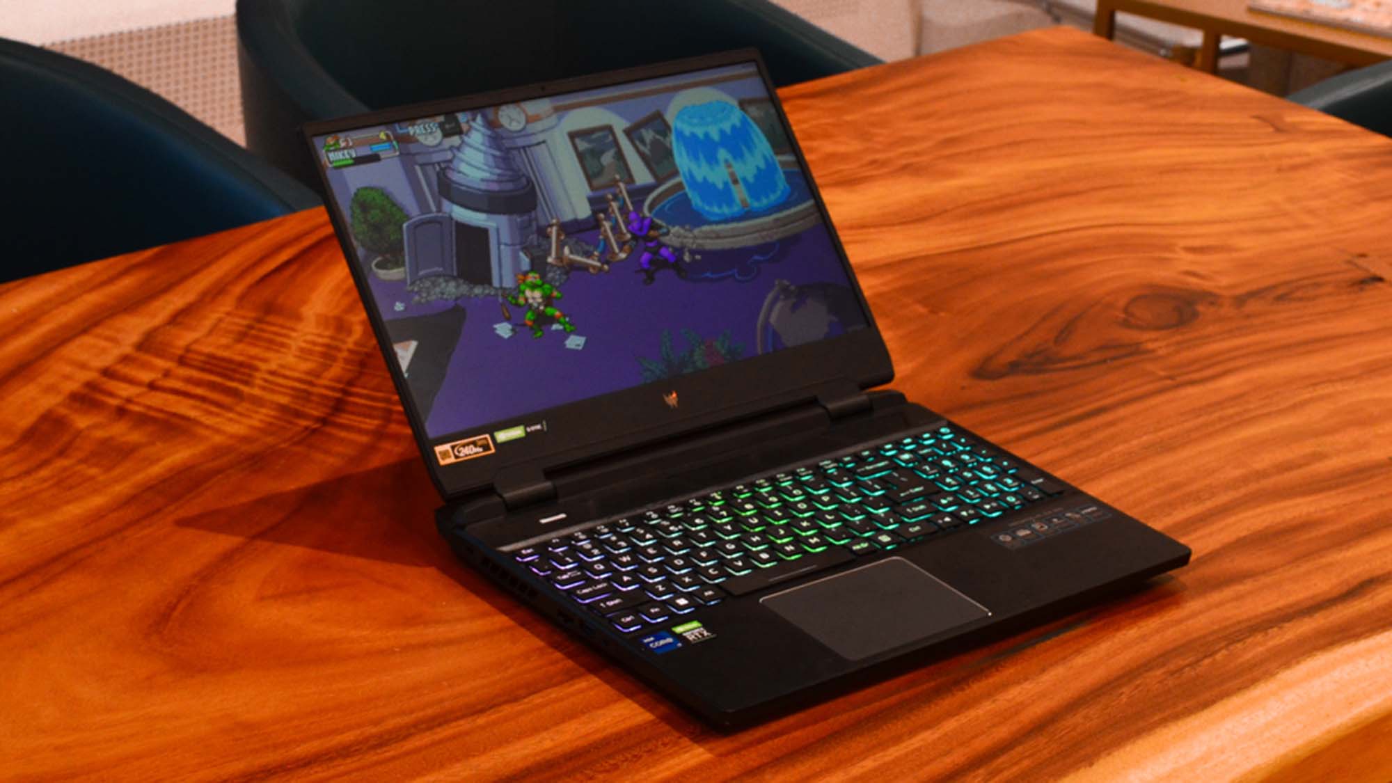 An Acer Predator Helios 300 (2022) sitting on a wooden table in a commissary