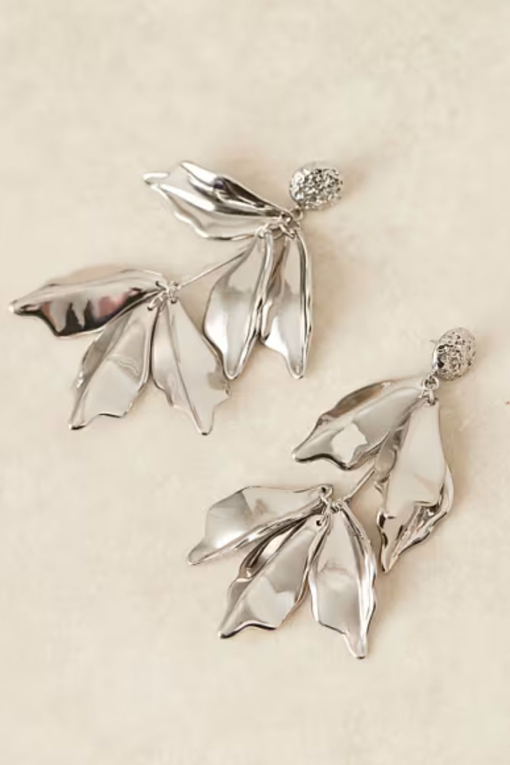ASOS DESIGN drop earrings in oversized petal design in silver tone