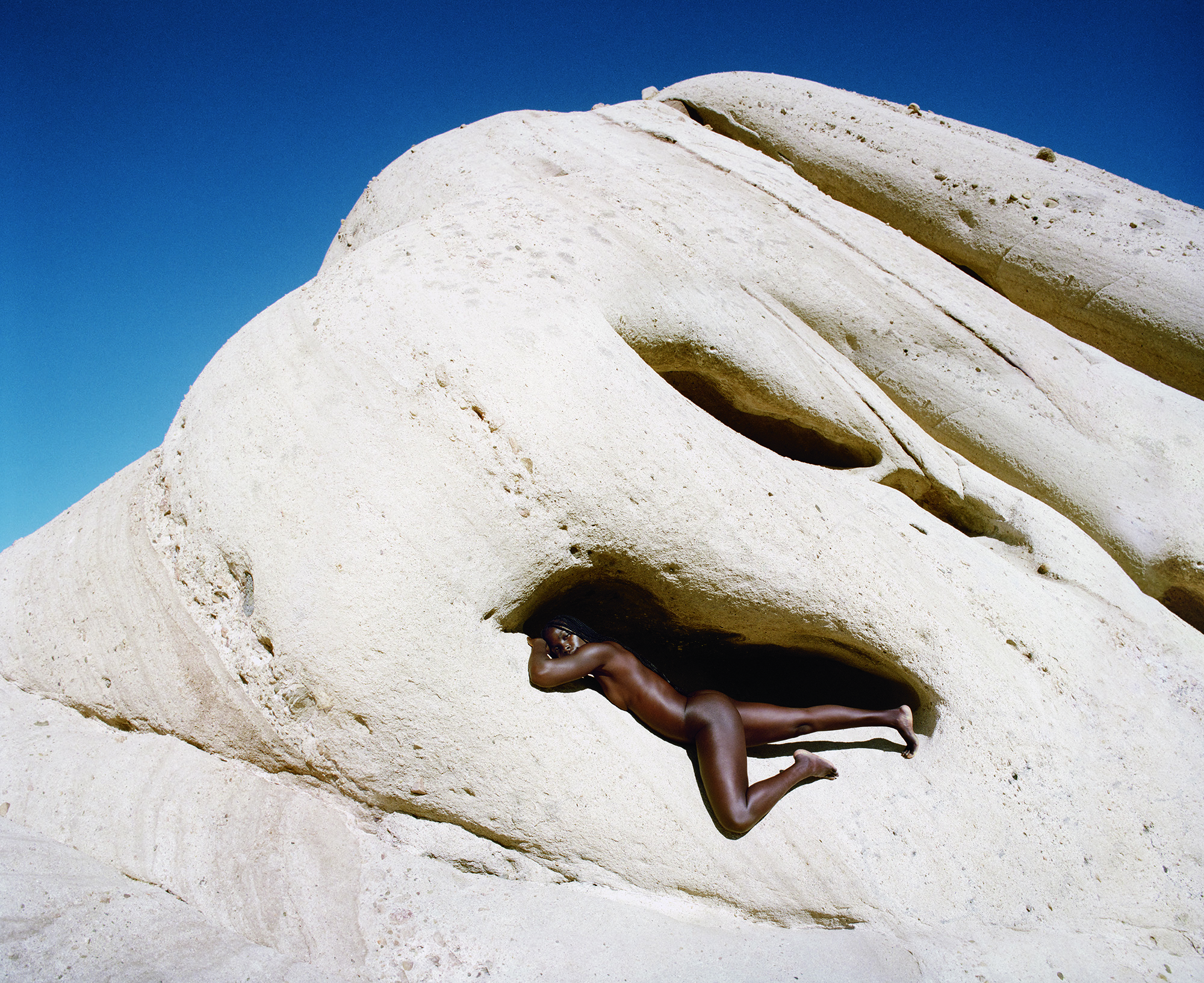 NeoNutritions campaign image: model from afar on rock