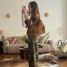 An image of a woman wearing camo pants outfit 2026