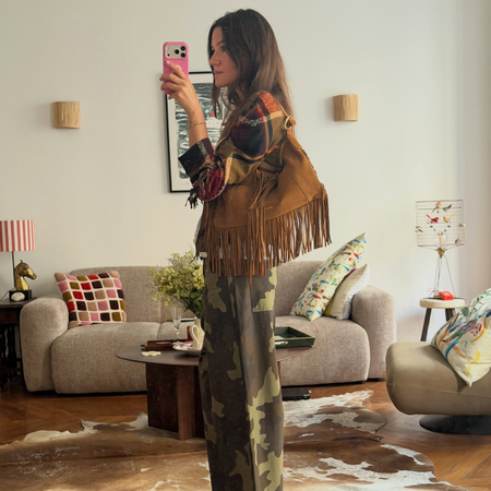 An image of a woman wearing camo pants outfit 2026