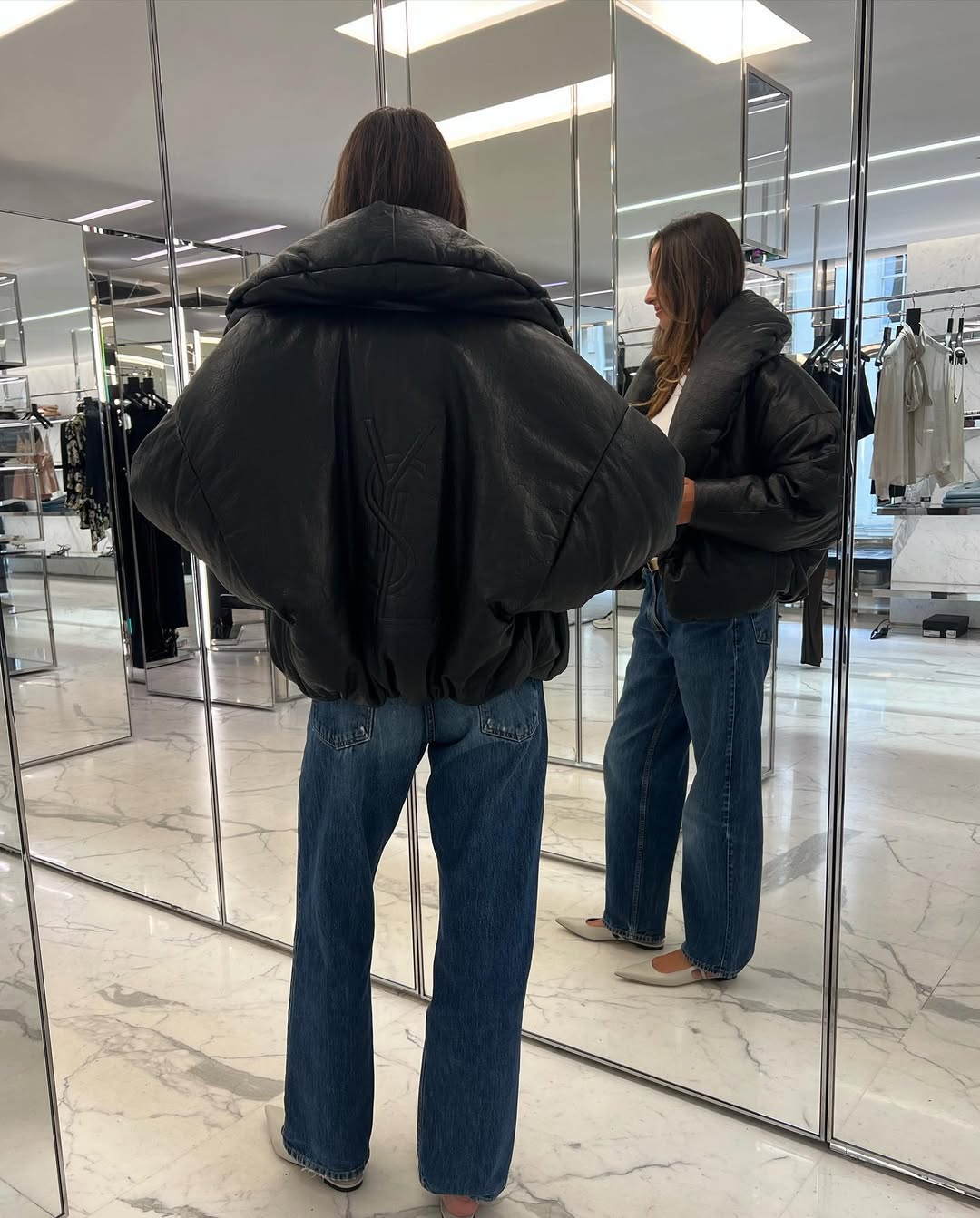 woman wearing dirty denim wash jeans fall denim trend 2025