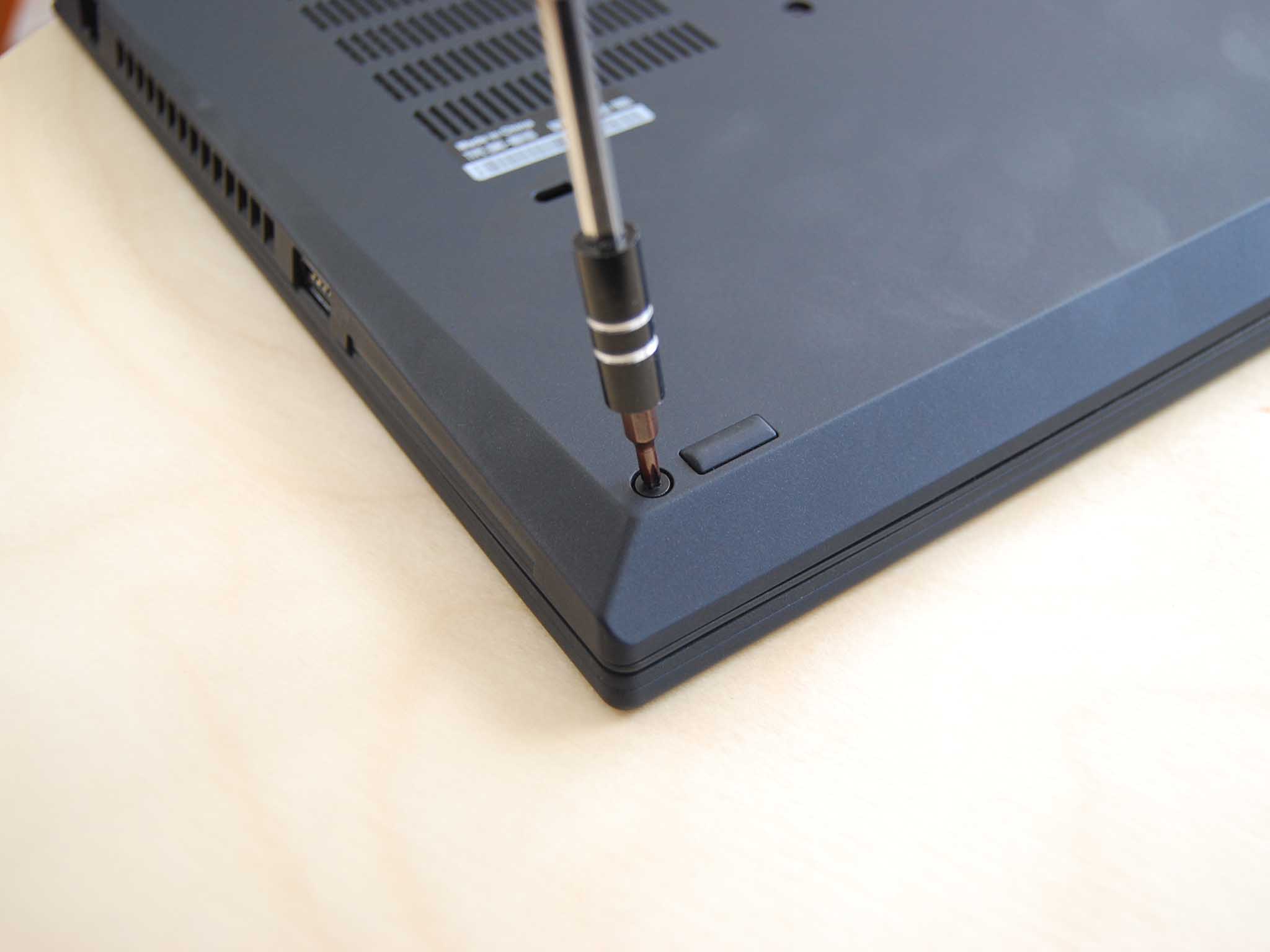 Unscrew the six black fasteners