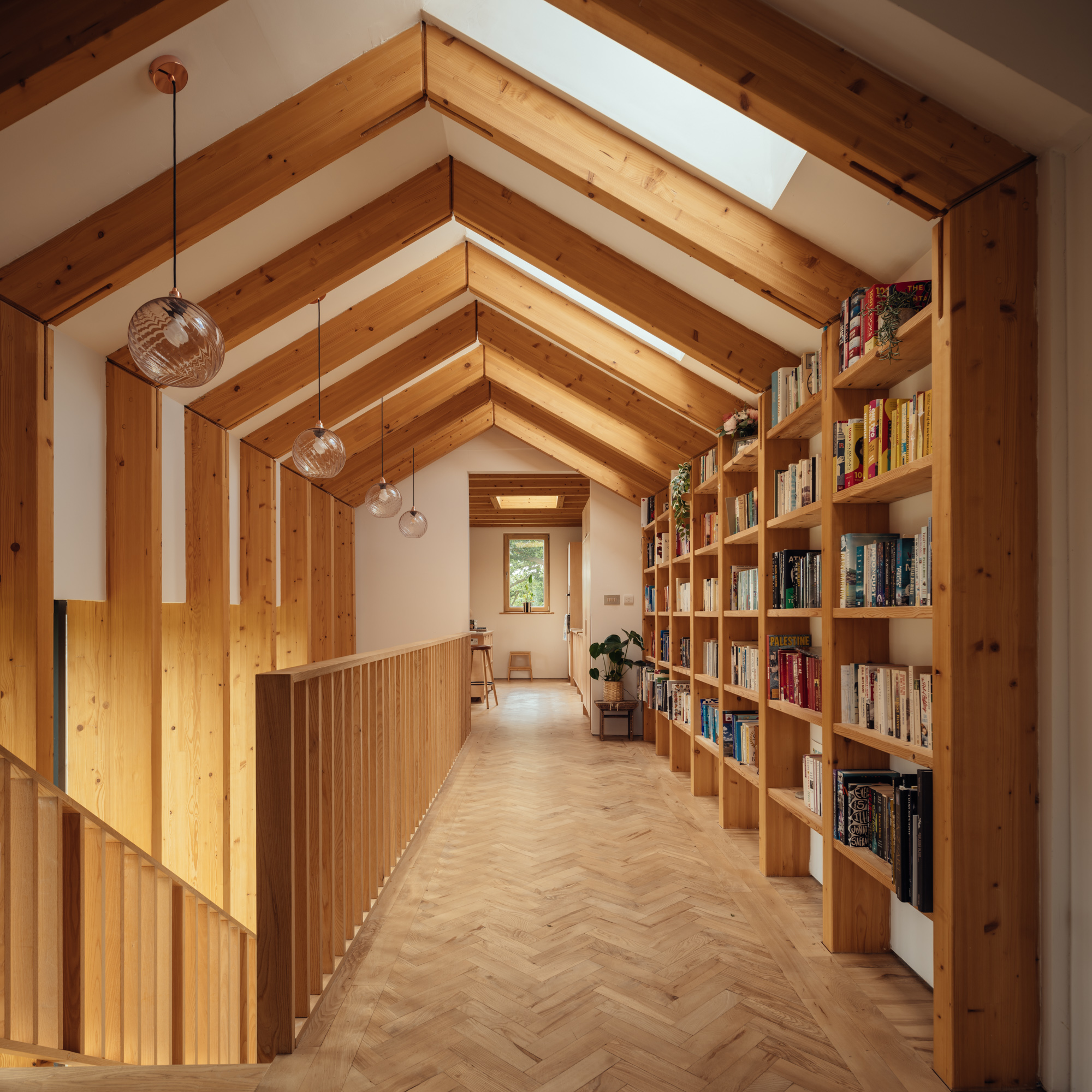 The central stair element has a pitched roof