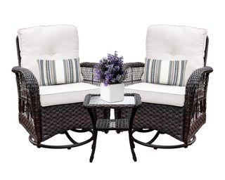A pair of dark brown wicker outdoor swivel rocking chairs