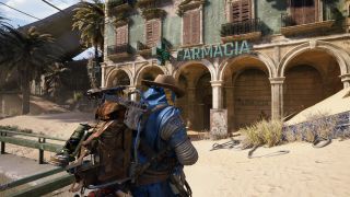 Arc Raiders Life of a Pharmacist: A raider wearing a blue poncho and a cowboy hat standing outside a pharmacist in the sandy Buried City during the day.