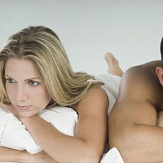 man and woman in bed