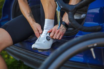 Image shows someones feet in cycling shoes