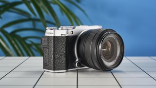 A Fujifilm X-M5 mirrorless vlogging camera in the silver colorway