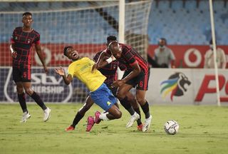 Mlungisi Mbunjana of TS Galaxy fouls Themba Zwane of Mamelodi Sundowns 