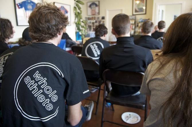 Whole Athlete - Specialized riders listen to a presentation.