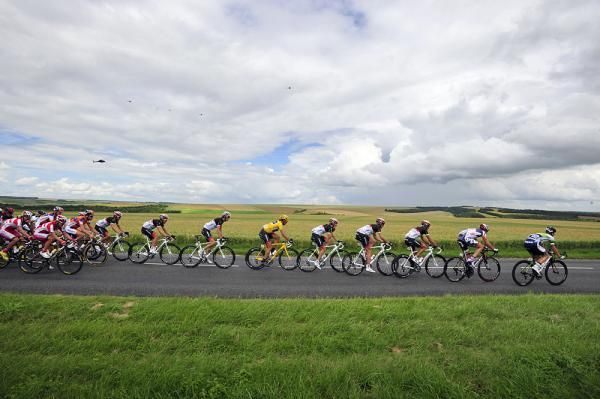 Flocks of helicopters circle overhead of the peloton