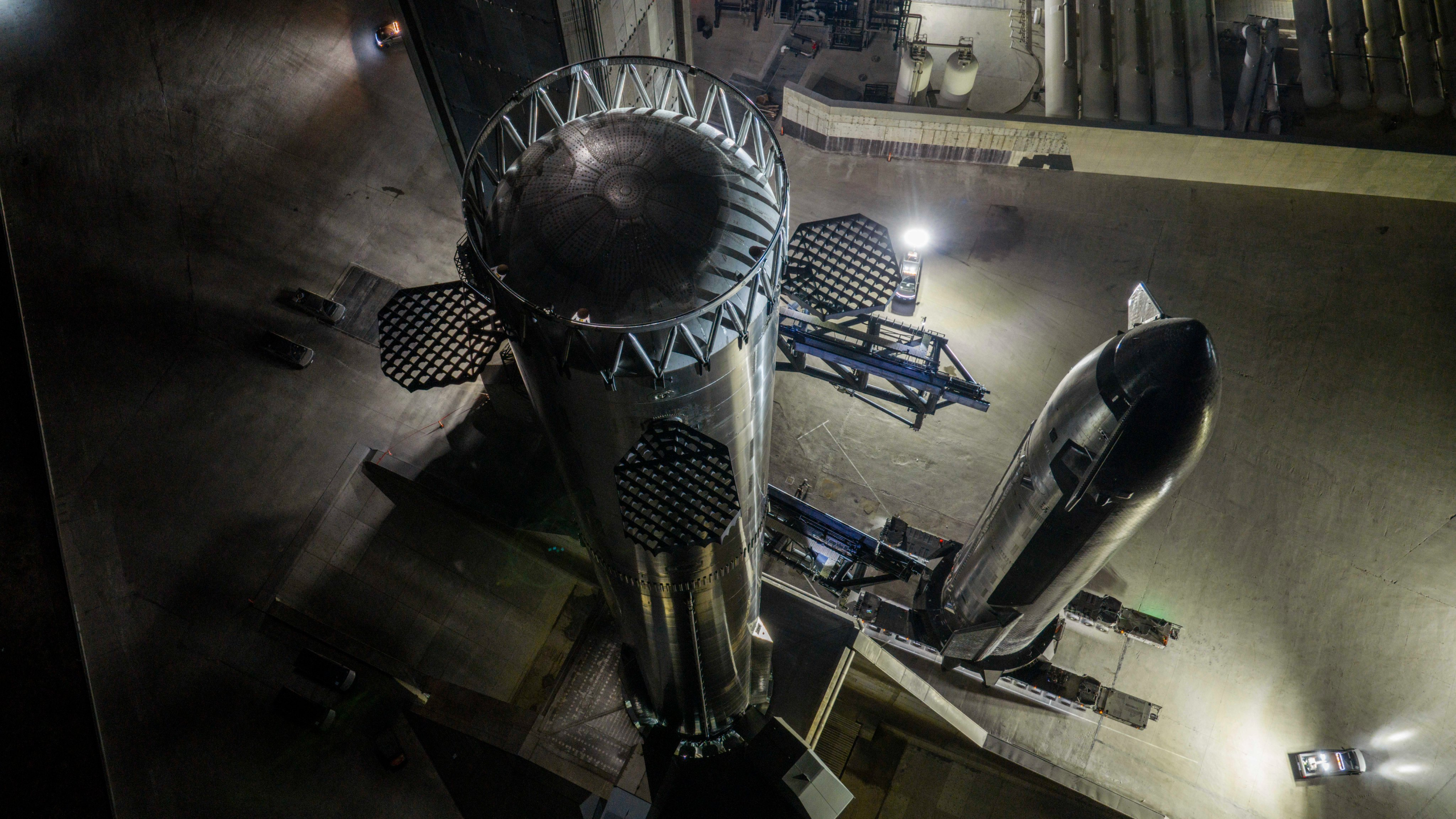 A giant spacecraft stands next to its booster awaiting stacking at SpaceX's Starbase Pad 2 for Flight 14, on Sept. 23, 2026.