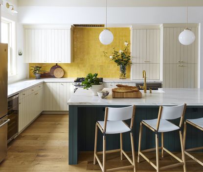 yellow kitchen ideas with a yellow backsplash made of tiles