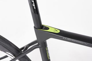 Dropped, thin seat stays boost comfort. The seat post bolt is very neat too